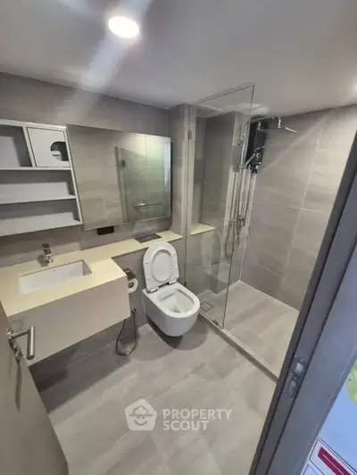 Modern bathroom with sleek design and glass shower enclosure