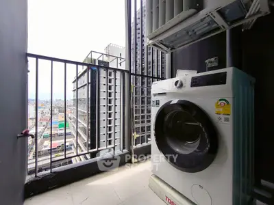 Modern balcony with city view and washing machine setup