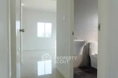Bright minimalist bathroom with modern fixtures and natural light