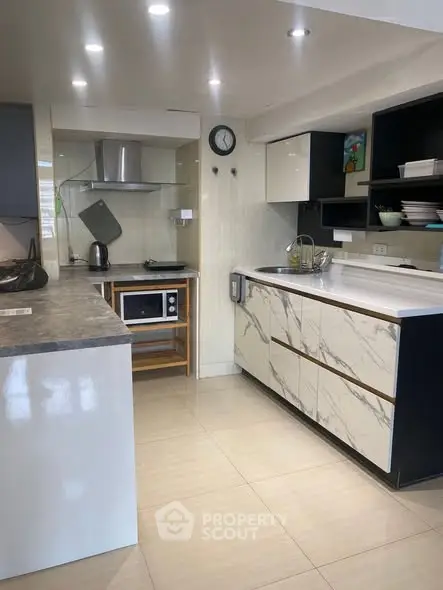 Modern kitchen with sleek cabinetry and marble countertops