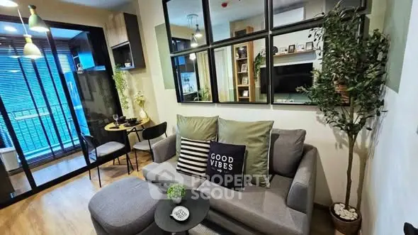 Stylish modern living room with cozy seating and decorative accents in a chic apartment.