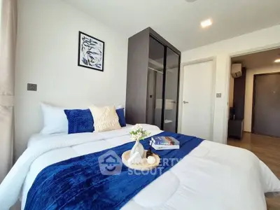 Modern bedroom with cozy blue accents and stylish decor