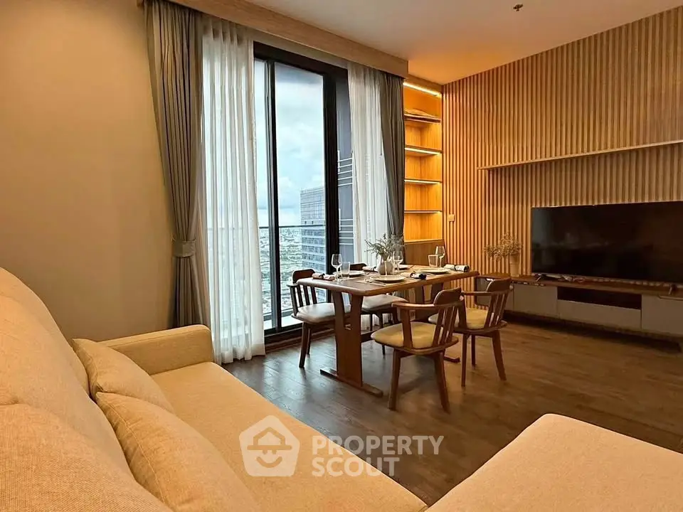 Modern living room with elegant dining area and city view
