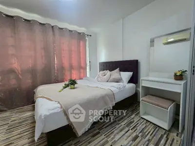 Cozy bedroom with modern decor and natural light, featuring a comfortable bed and stylish flooring.