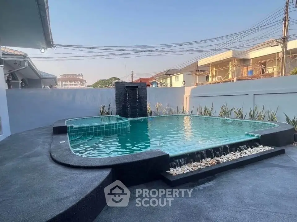 Stunning private pool with modern design in a serene residential area, perfect for relaxation and entertainment.