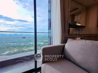 Luxurious apartment with stunning cityscape view from the living room balcony.