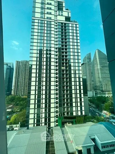 Stunning high-rise building with modern architecture and cityscape views, perfect for urban living.