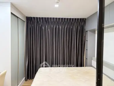 Modern bedroom with sleek design and luxurious curtains