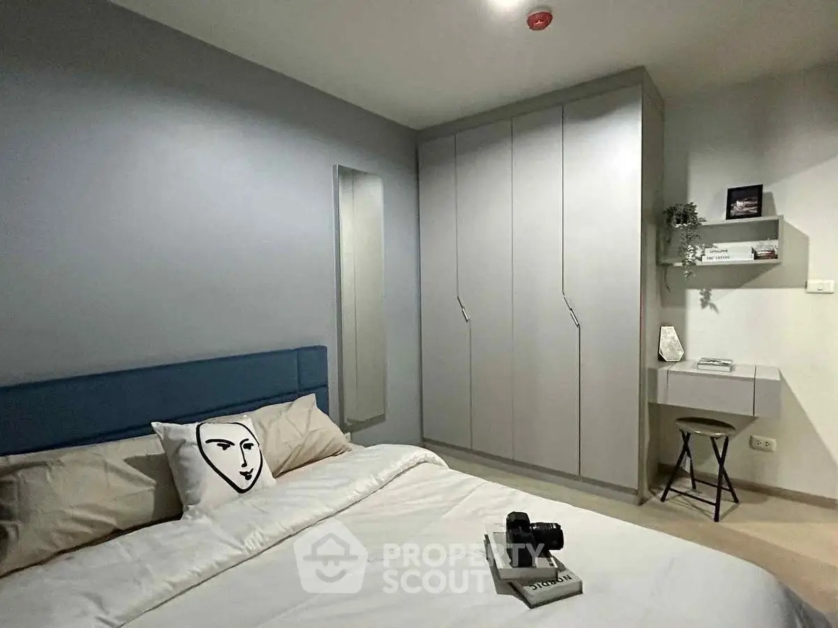 Modern bedroom with stylish decor and built-in wardrobe