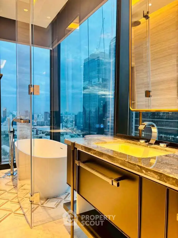 Luxurious bathroom with city view, featuring modern fixtures and a freestanding bathtub.