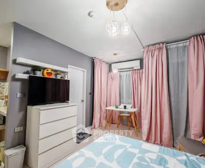 Charming bedroom with modern decor, featuring a cozy dining nook and stylish lighting.
