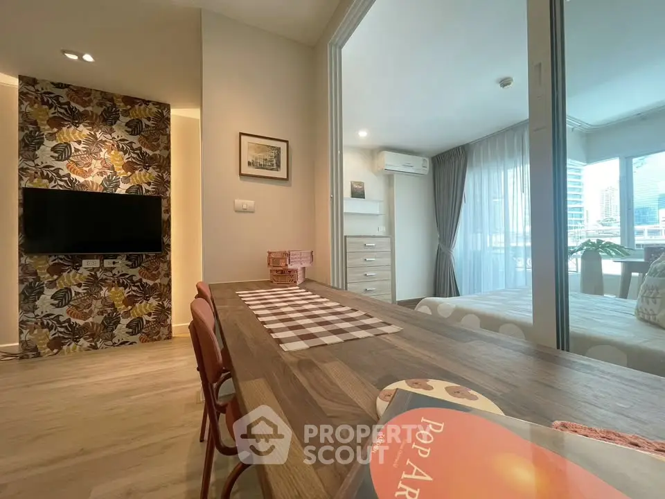 Modern apartment interior with stylish decor and open layout, featuring a cozy bedroom and dining area.