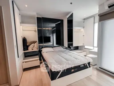 Modern bedroom with sleek design and ample storage in a contemporary apartment.
