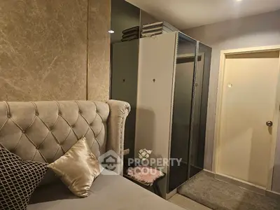 Cozy bedroom with elegant decor and plush bedding