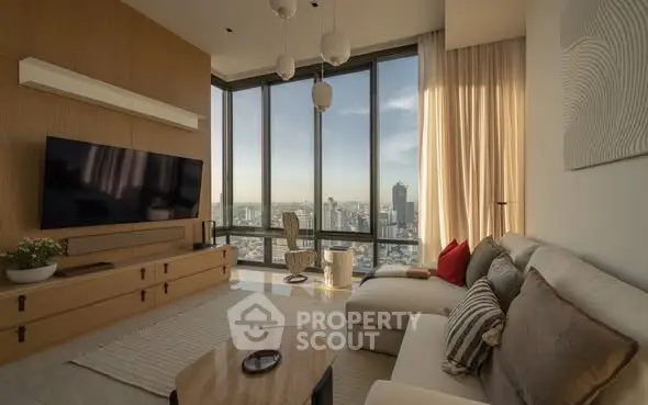 Luxurious living room with panoramic city view, modern decor, and elegant furnishings.