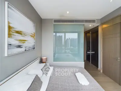 Modern bedroom with city view and stylish decor in luxury apartment