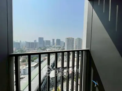Stunning cityscape view from a high-rise balcony, perfect for urban living.