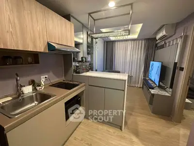 Modern kitchen with sleek cabinetry and open layout in stylish apartment