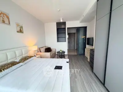 Modern bedroom with stylish decor and ample storage in a contemporary apartment.