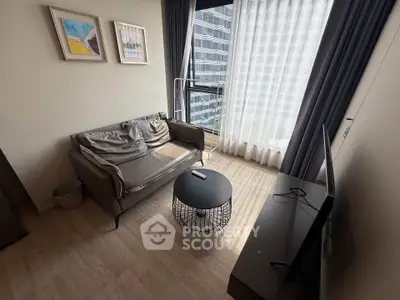 Modern living room with cozy sofa and large window view