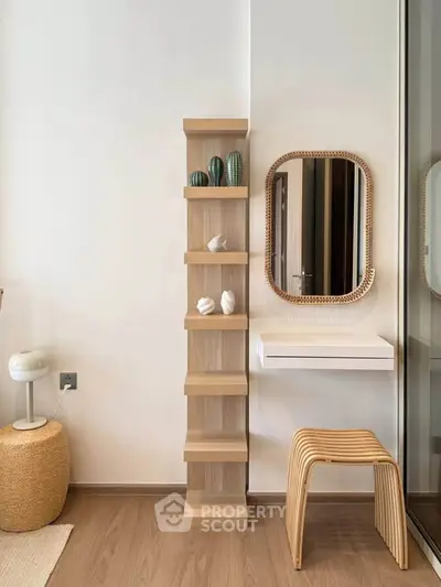 Modern minimalist interior with stylish shelving and mirror in a cozy living space.
