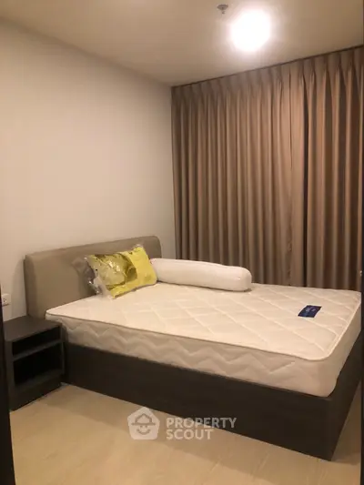 Cozy bedroom with modern design and elegant curtains