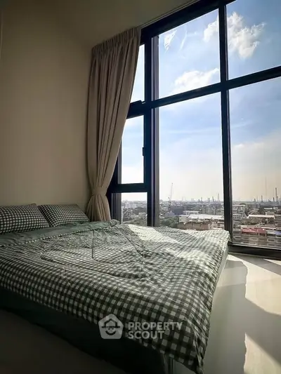 Cozy bedroom with panoramic city view and large windows