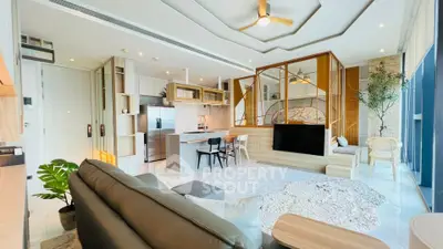 Luxurious open-plan living room with modern kitchen and stylish decor