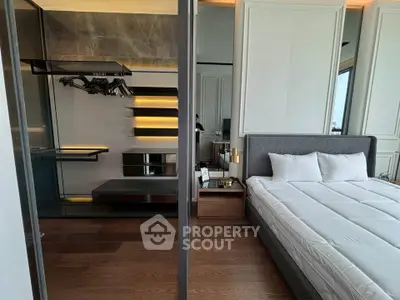 Luxurious modern bedroom with elegant walk-in closet and stylish decor