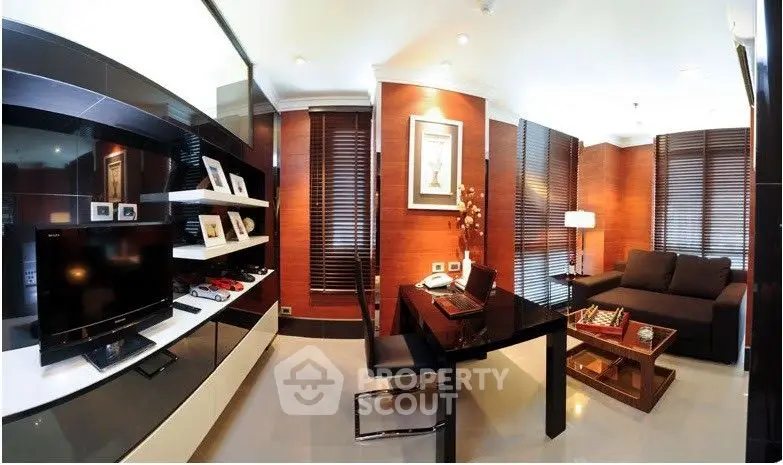 Elegant living room with modern furnishings, sleek black entertainment unit, and warm wooden blinds creating a cozy atmosphere.