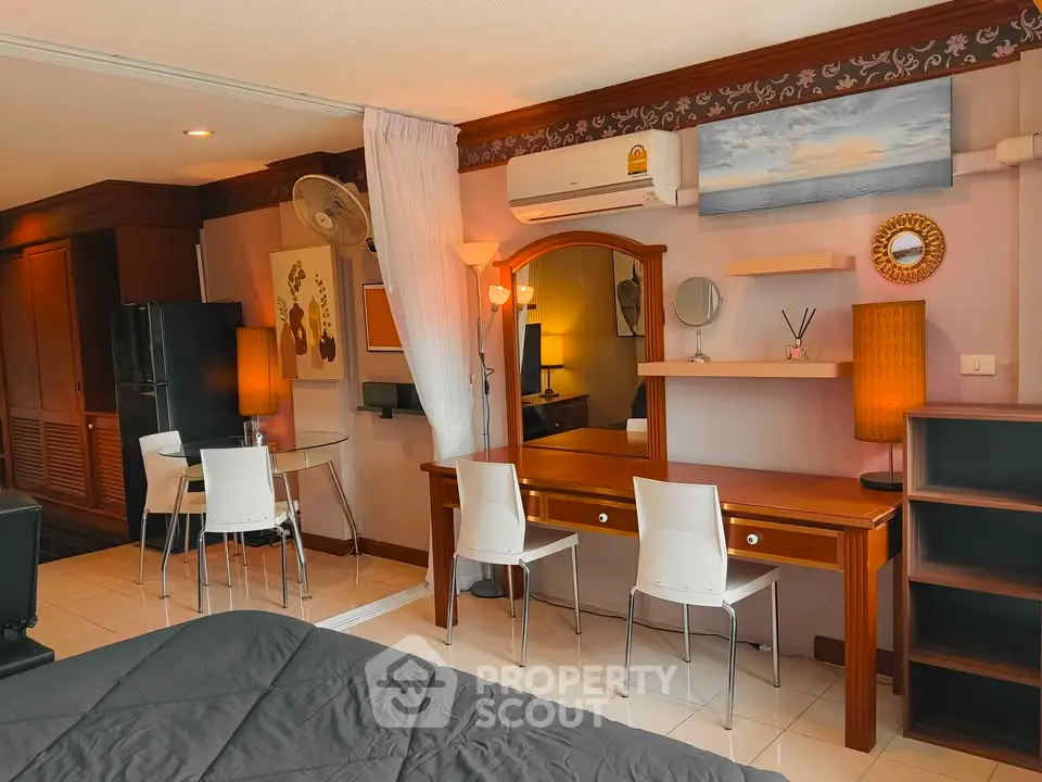 Spacious studio apartment with elegant wooden furniture and modern decor