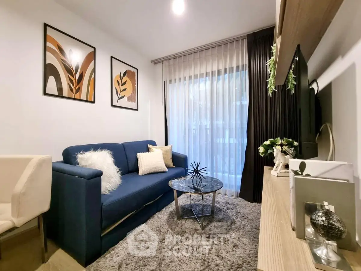 Stylish modern living room with cozy blue sofa and chic decor