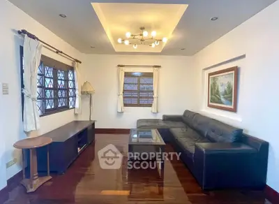 Elegant living room with modern lighting and stylish furniture, perfect for relaxation and entertainment.