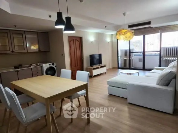 Spacious modern living room with open kitchen and stylish decor