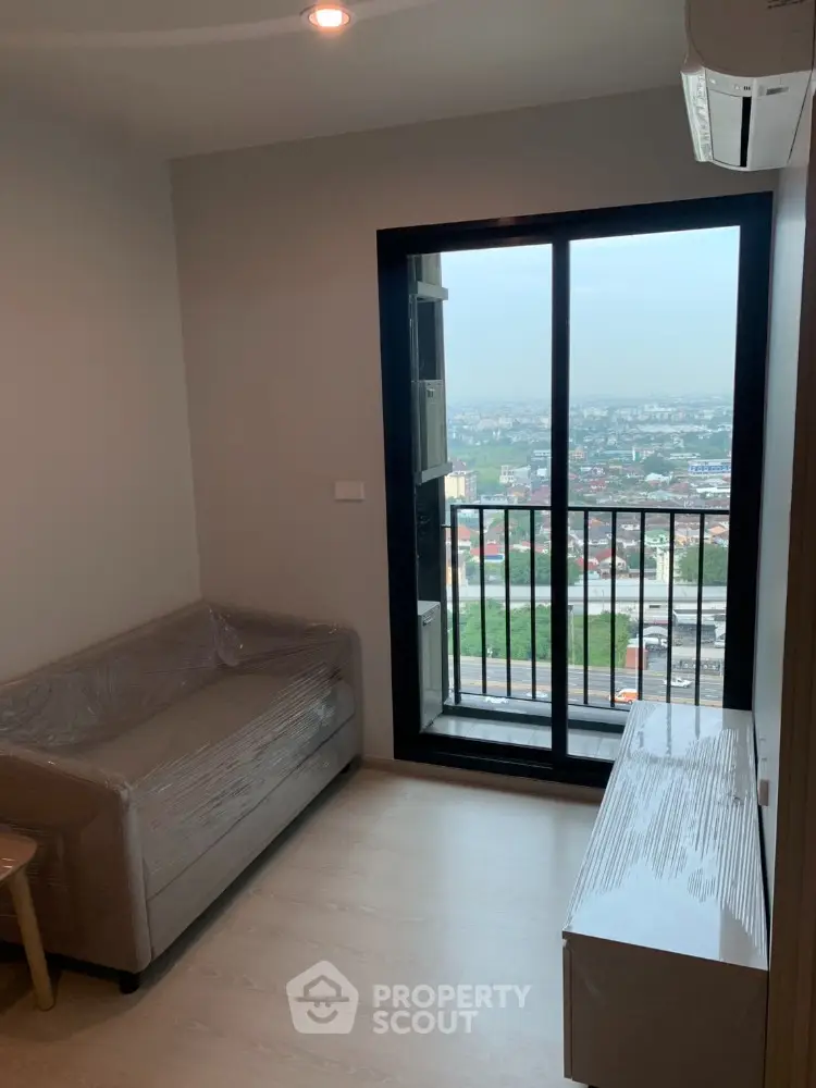 Modern apartment living room with city view balcony and sleek furniture