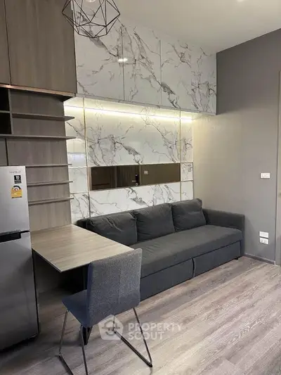Modern living room with sleek marble accents and stylish furniture