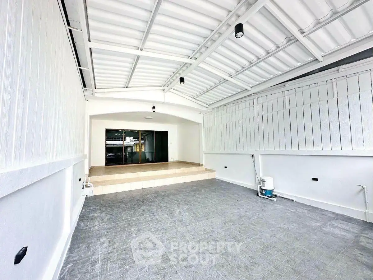Spacious covered parking area with modern design and ample lighting