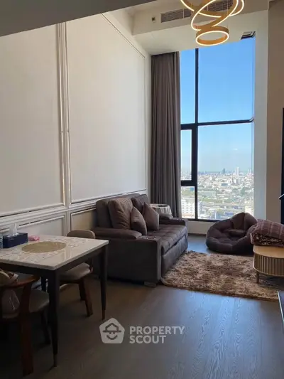 Luxurious high-rise living room with stunning city view and modern decor.