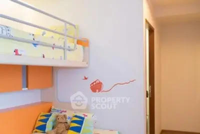 Charming children's bedroom with bunk beds and playful decor in a cozy home setting.