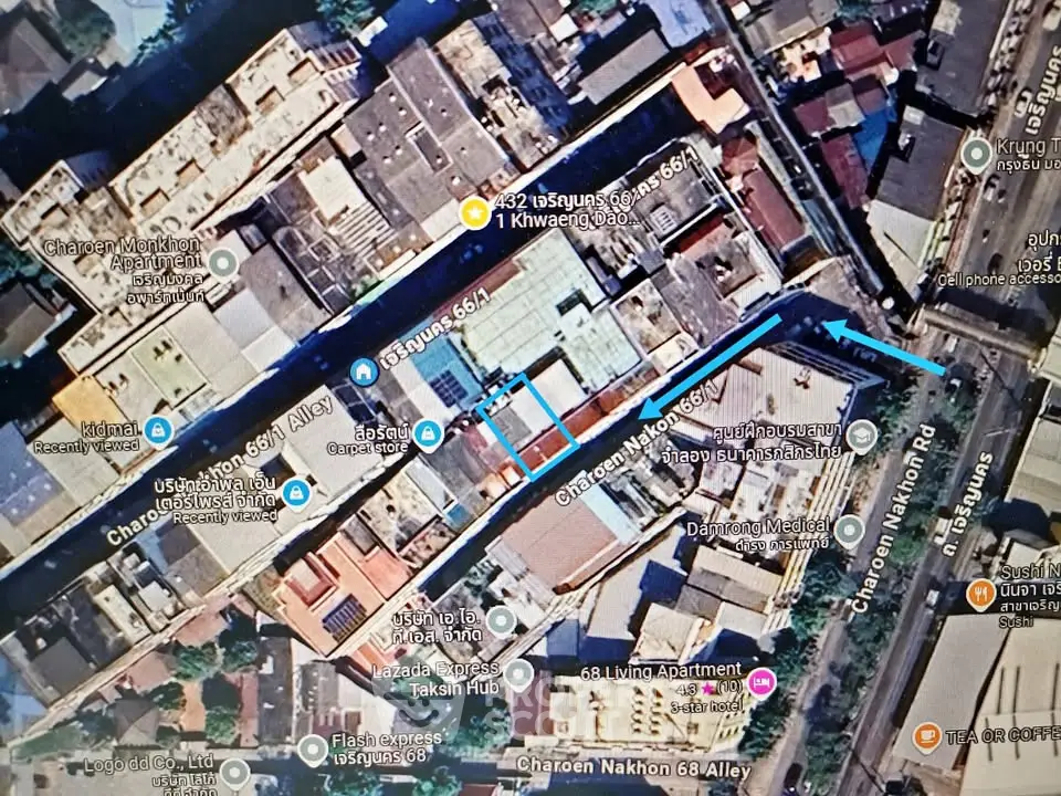 Aerial view of urban real estate development with detailed street map overlay.