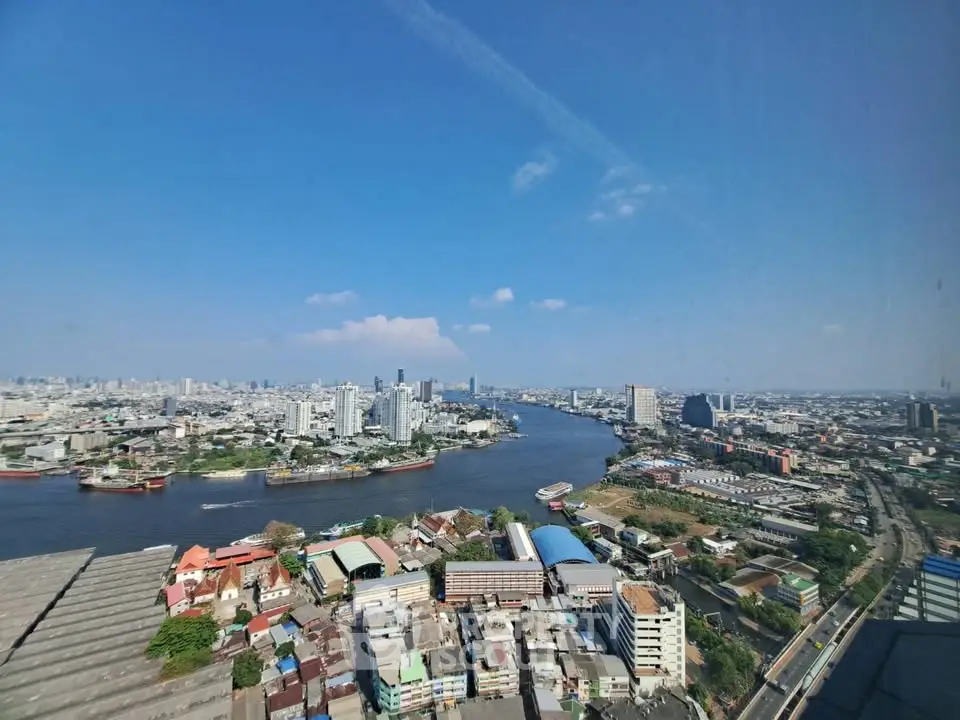 Stunning panoramic cityscape view from high-rise building overlooking river and skyline.