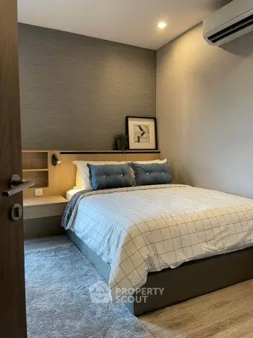 Cozy modern bedroom with stylish decor and comfortable bedding