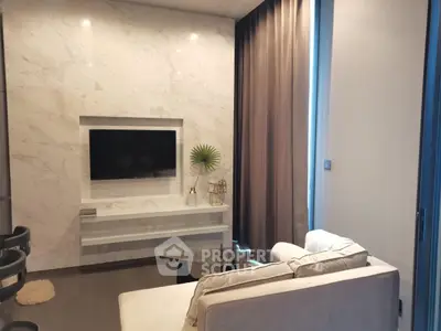 Modern living room with sleek marble wall and cozy seating area