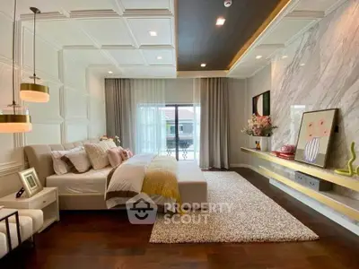 Luxurious bedroom with elegant decor and large window offering natural light