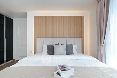 Elegant bedroom with modern design, featuring a cozy bed, stylish headboard, and soft lighting for a relaxing ambiance.
