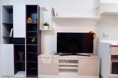 Modern living room with sleek TV unit and stylish shelving