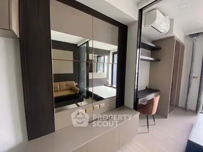 Modern bedroom with stylish built-in furniture and elegant decor