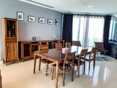 Elegant dining room with wooden furniture and large windows in modern apartment