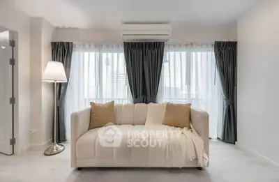 Modern living room with cozy sofa and elegant floor lamp