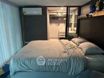 Modern bedroom with cozy bedding and sleek wardrobe design